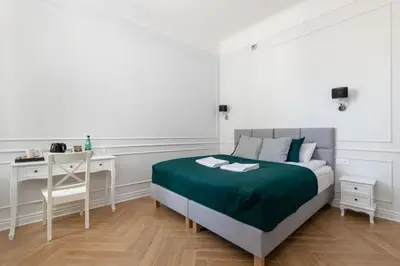 Łóżko lub łóżka w pokoju w obiekcie Lwowska 9 - Intimate & Comfortable Studio by Noclegi Renters