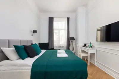 Łóżko lub łóżka w pokoju w obiekcie Lwowska 9 - Intimate & Comfortable Studio by Noclegi Renters