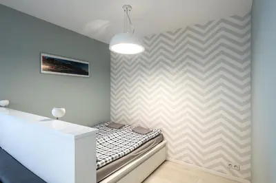 Łóżko lub łóżka w pokoju w obiekcie Waw Apartamenty Manhattan