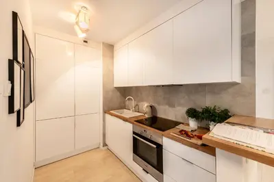 Kuchnia lub aneks kuchenny w obiekcie Waw Apartamenty Manhattan