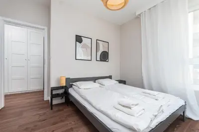 Łóżko lub łóżka w pokoju w obiekcie Aleja Sikorskiego 18 by Homeprime