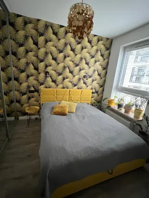 Łóżko lub łóżka w pokoju w obiekcie Konstruktorska Chill