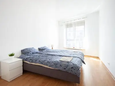 Łóżko lub łóżka w pokoju w obiekcie Waw Apartamenty Wilanów Branickiego