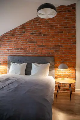 Łóżko lub łóżka w pokoju w obiekcie Moon Apartments Warszawa