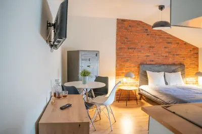 Łóżko lub łóżka w pokoju w obiekcie Moon Apartments Warszawa
