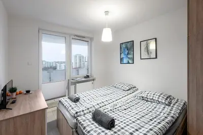 Łóżko lub łóżka w pokoju w obiekcie Waw Mokotów pokoje Manhattan