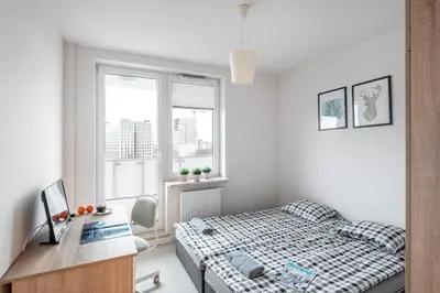 Łóżko lub łóżka w pokoju w obiekcie Waw Mokotów pokoje Manhattan