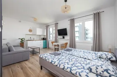 Łóżko lub łóżka w pokoju w obiekcie Warsaw-Aparts Herbu Janina Szpital