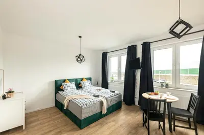 Łóżko lub łóżka w pokoju w obiekcie Warsaw-Aparts Herbu Janina Szpital