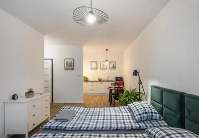 Łóżko lub łóżka w pokoju w obiekcie Warsaw-Aparts Herbu Janina Szpital