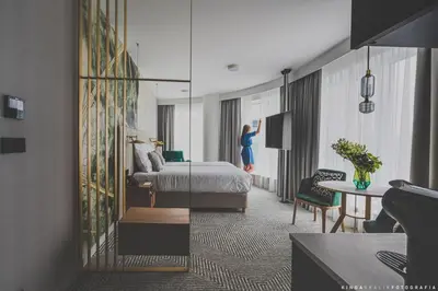 Łóżko lub łóżka w pokoju w obiekcie Royal Tulip Warsaw Centre