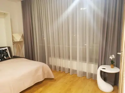 Łóżko lub łóżka w pokoju w obiekcie Apartamenty Aleje Jerozolimskie