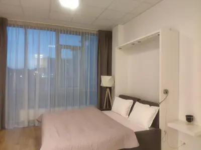 Łóżko lub łóżka w pokoju w obiekcie Apartamenty Aleje Jerozolimskie