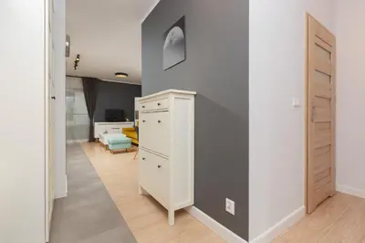Łóżko lub łóżka w pokoju w obiekcie Active City Apartments Warsaw by Noclegi Renters