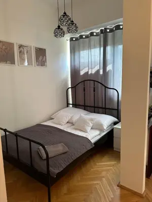 Łóżko lub łóżka w pokoju w obiekcie Centrum Apartamenty