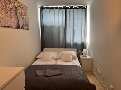 Łóżko lub łóżka w pokoju w obiekcie Centrum Apartamenty