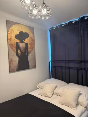 Łóżko lub łóżka w pokoju w obiekcie Centrum Apartamenty