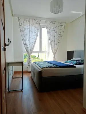 Łóżko lub łóżka w pokoju w obiekcie Aura Sky Ostrobramska Prestige