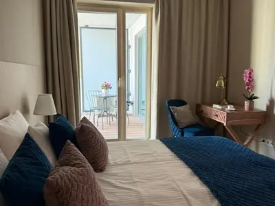 Łóżko lub łóżka w pokoju w obiekcie Apartament Powiśle Deluxe with Parking