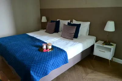 Łóżko lub łóżka w pokoju w obiekcie Apartament Powiśle Deluxe with Parking