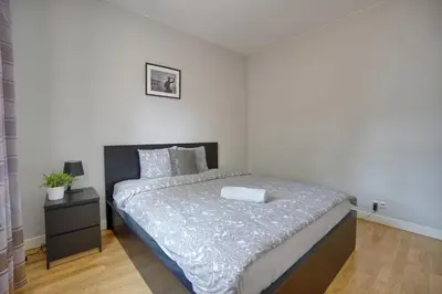Łóżko lub łóżka w pokoju w obiekcie Warsaw Premium Apartments Old Town Rycerska