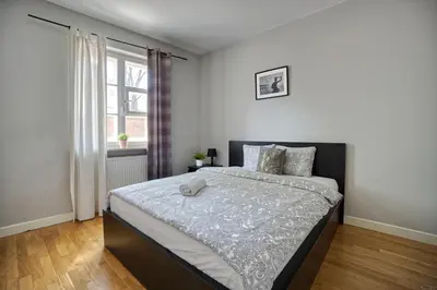 Łóżko lub łóżka w pokoju w obiekcie Warsaw Premium Apartments Old Town Rycerska