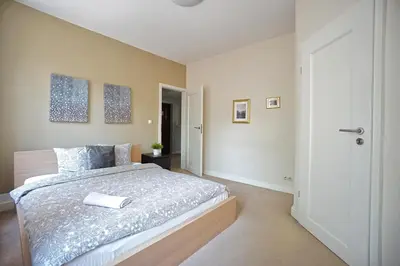 Łóżko lub łóżka w pokoju w obiekcie Warsaw Premium Apartments Old Town Rycerska