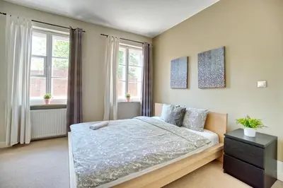 Łóżko lub łóżka w pokoju w obiekcie Warsaw Premium Apartments Old Town Rycerska