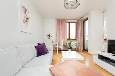 Część wypoczynkowa w obiekcie Apartament Na Woli Sowińskiego by Noclegi Renters