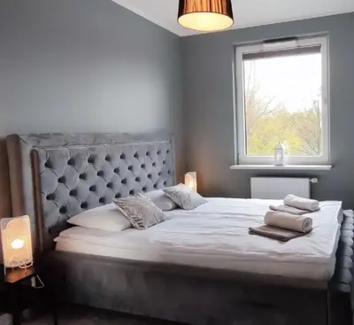 Łóżko lub łóżka w pokoju w obiekcie Labo Apartment Fort Wola