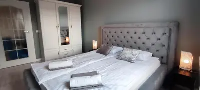Łóżko lub łóżka w pokoju w obiekcie Labo Apartment Fort Wola