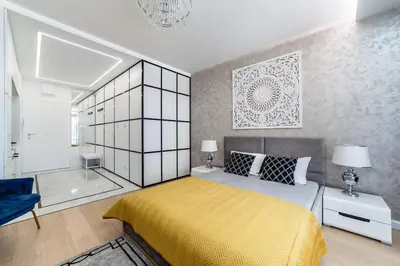 Łóżko lub łóżka w pokoju w obiekcie Luksusowy apartament Centrum Warszawy z tarasem