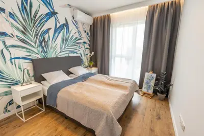Łóżko lub łóżka w pokoju w obiekcie Home Apartament Metro Młociny 97
