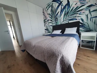 Łóżko lub łóżka w pokoju w obiekcie Home Apartament Metro Młociny 97