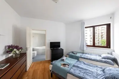 Łóżko lub łóżka w pokoju w obiekcie Waw pokoje Wilanów