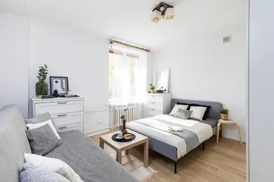 Łóżko lub łóżka w pokoju w obiekcie SuperApart Dzielna 9a