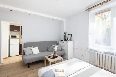 Łóżko lub łóżka w pokoju w obiekcie SuperApart Dzielna 9a
