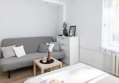 Łóżko lub łóżka w pokoju w obiekcie SuperApart Dzielna 9a
