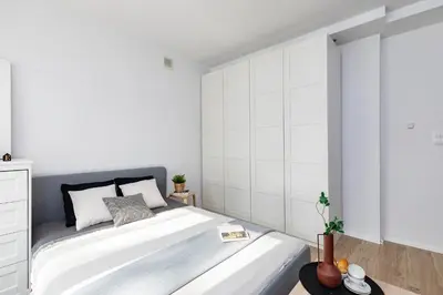 Łóżko lub łóżka w pokoju w obiekcie SuperApart Dzielna 9a