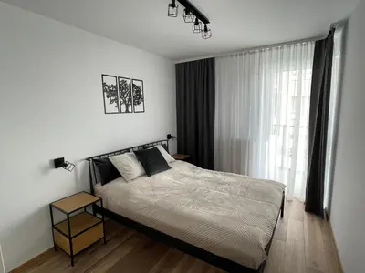 Łóżko lub łóżka w pokoju w obiekcie NEWPORT Industrial Apartment