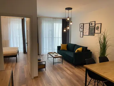 Łóżko lub łóżka w pokoju w obiekcie NEWPORT Industrial Apartment