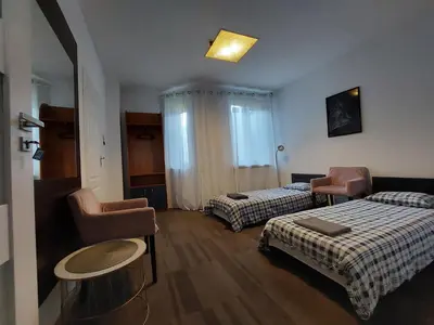 Łóżko lub łóżka w pokoju w obiekcie Pokoje gościnne na Lwowskiej