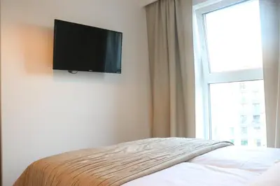 Telewizja i/lub zestaw kina domowego w obiekcie Rakowska Home - Miejsce w garażu w cenie - Parking Spot Included