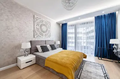Łóżko lub łóżka w pokoju w obiekcie Luksusowy apartament z tarasem Centrum Warszawy