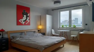 Łóżko lub łóżka w pokoju w obiekcie Sunny Apartment Warszawa
