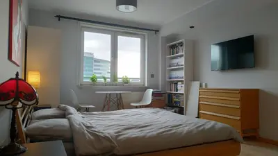 Łóżko lub łóżka w pokoju w obiekcie Sunny Apartment Warszawa