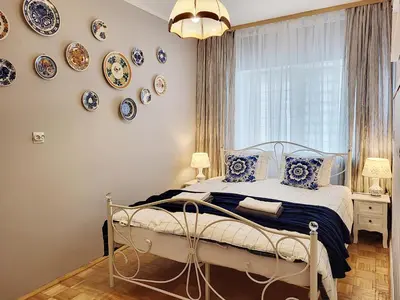 Łóżko lub łóżka w pokoju w obiekcie HUSARSKA 60