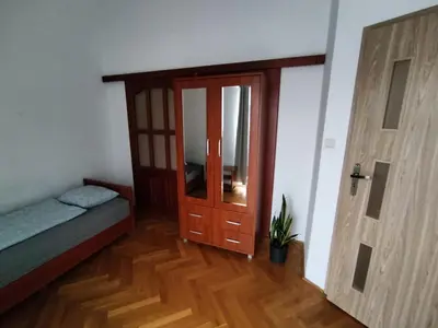 Łóżko lub łóżka w pokoju w obiekcie Classic Apartament Metro Kabaty