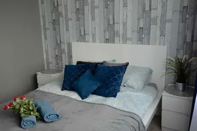 Łóżko lub łóżka w pokoju w obiekcie Apartament Wika