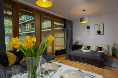 Łóżko lub łóżka w pokoju w obiekcie Kolejowa Apartments Warsaw by Noclegi Renters